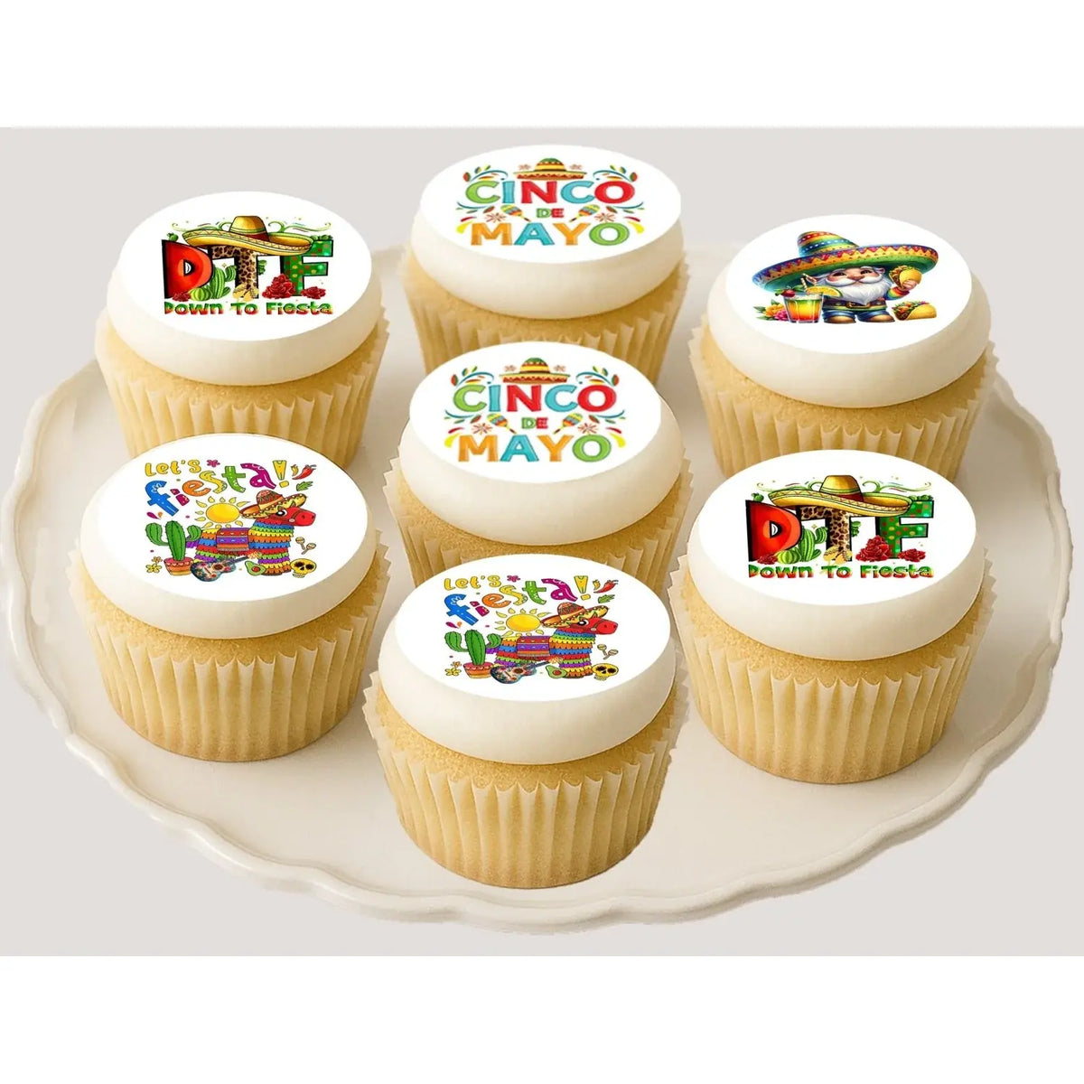 Cinco de Mayo edible icing cookie and cupcake toppers with assorted Cinco de Mayo designs, on cupcakes.