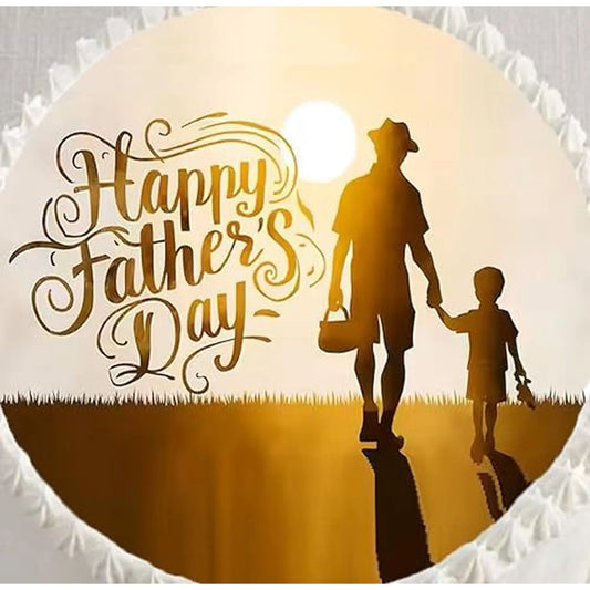 Father's Day edible icing cake topper with a father and child silhouette, shown close up on a cake.