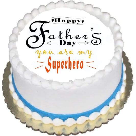 Father's Day edible icing cake topper with You Are My Superhero lettering, shown on a frosted cake.