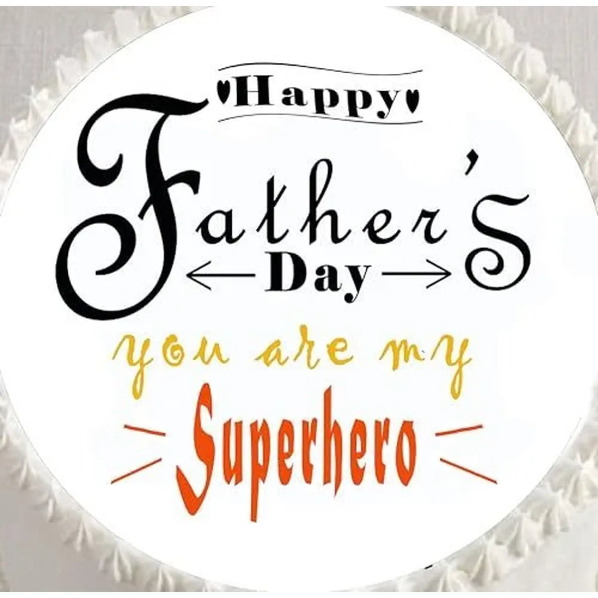 Father's Day edible icing cake topper with You Are My Superhero lettering, shown close up on a cake.