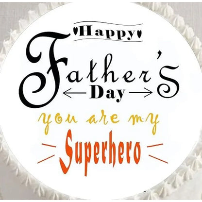 Father's Day edible icing cake topper with You Are My Superhero lettering, shown close up on a cake.