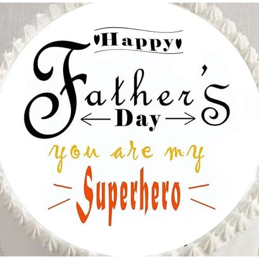Father's Day edible icing cake topper with You Are My Superhero lettering, shown close up on a cake.