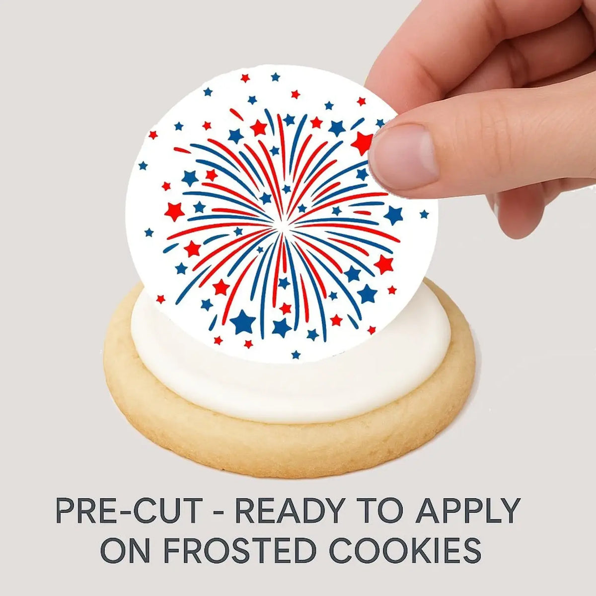 July 4th Fireworks Edible Cookie & Cupcake Toppers – 20 Precut being placed on a frosted cookie.