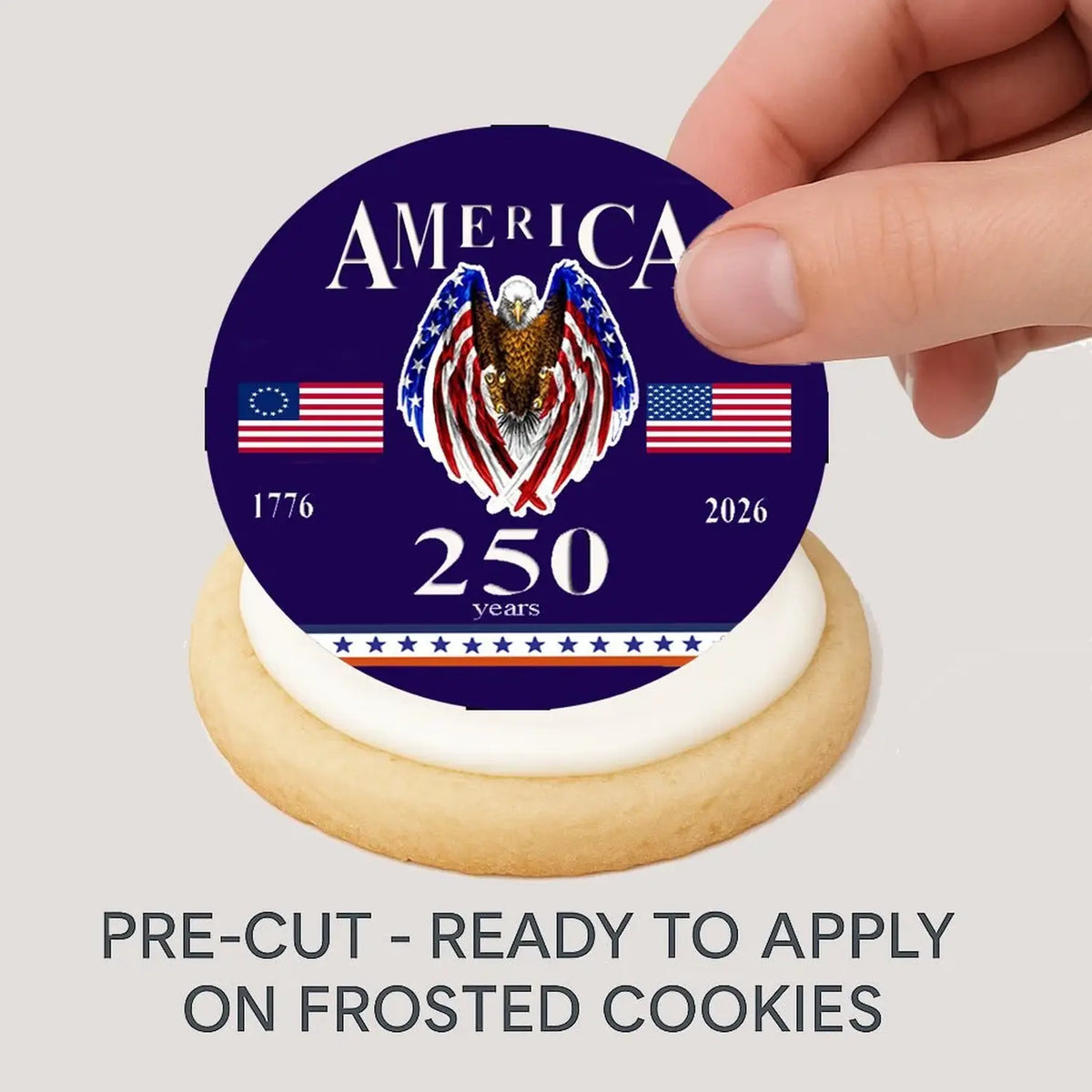 USA 250th Anniversary Happy Birthday Edible Cookie & Cupcake Toppers – 20 Precut being placed on a frosted cookie.