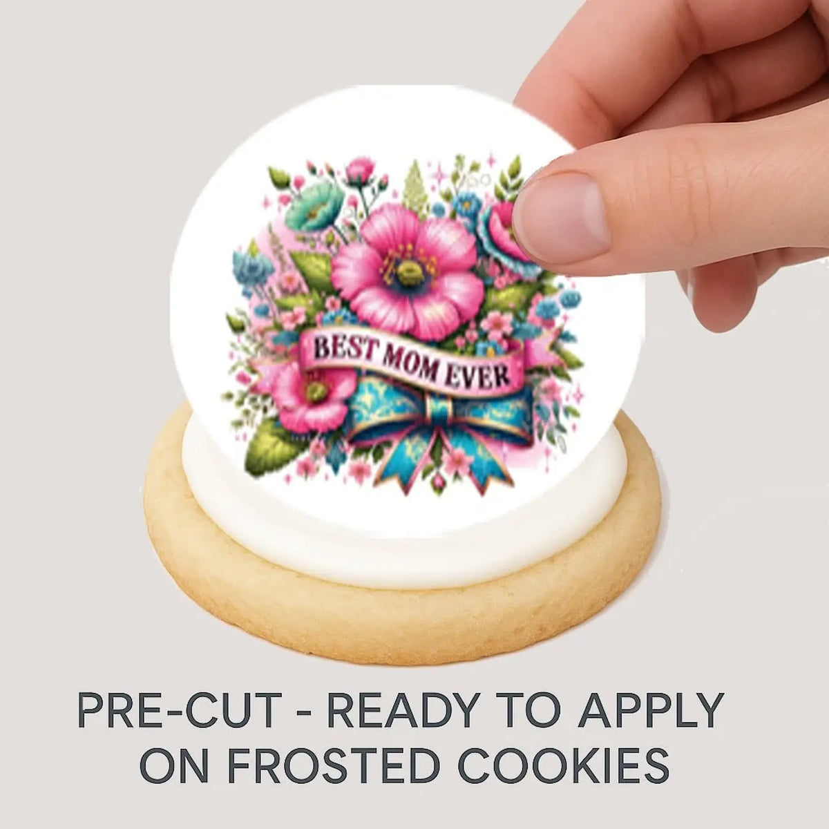 Mother's Day Best Mom Ever Edible Cookie & Cupcake Toppers – 20 Precut being placed on a frosted cookie.
