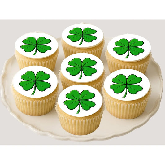 St. Patrick's Day edible icing cookie and cupcake toppers with four-leaf clover, on cupcakes.