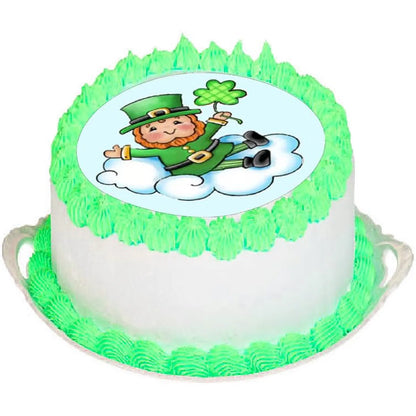 St. Patrick's Day edible icing cake topper with leprechaun sitting on a cloud, on a green frosted cake.